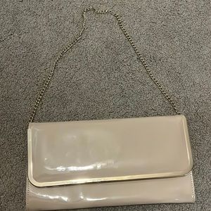 a cream colored purse